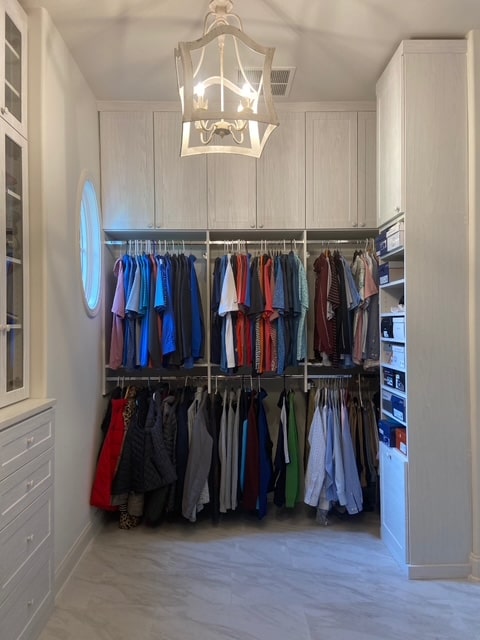 Beautiful custom closet with white cabinets