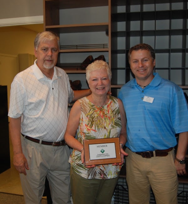 Owner Chris Carruth with family in Showroom